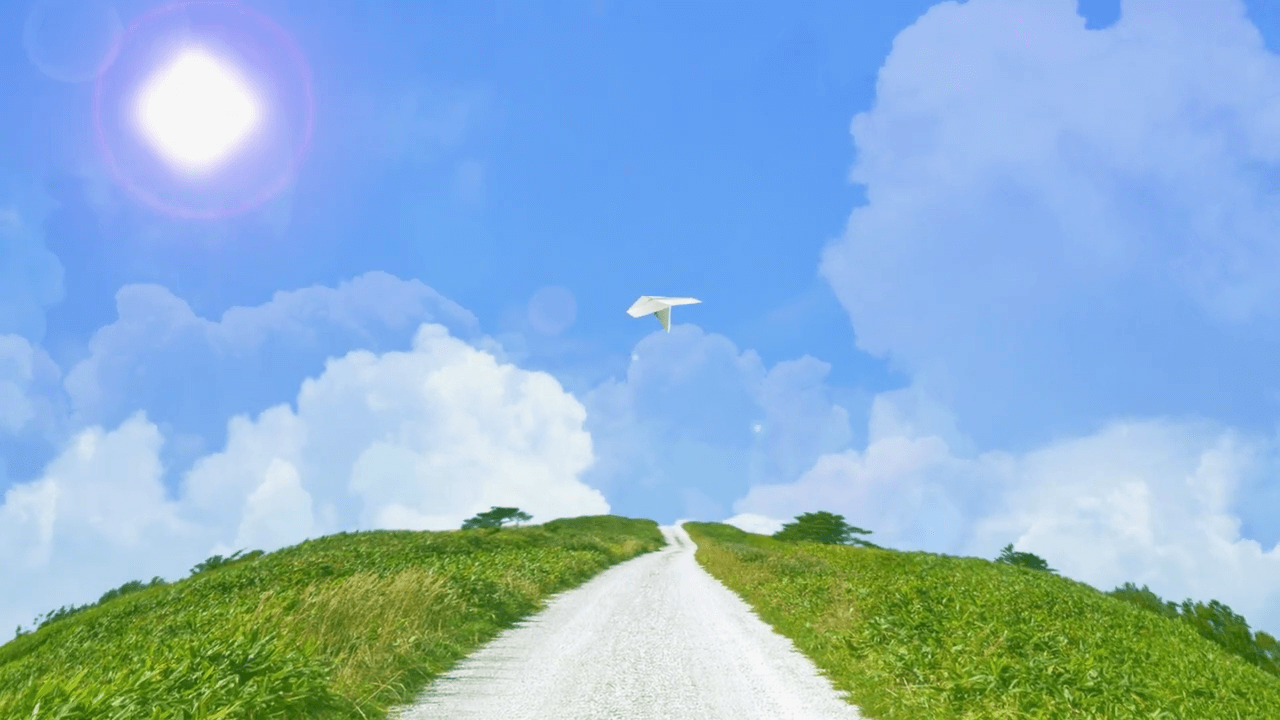 丘の上の空に紙飛行機が飛ぶ｜モーショングラフィック